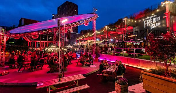 Outdoor tables and lights at Freight Island, the food and music venue in Manchester.