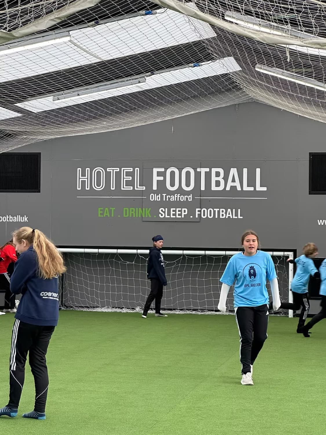 Players on an IPPE soccer tour in the Manchester United environment
