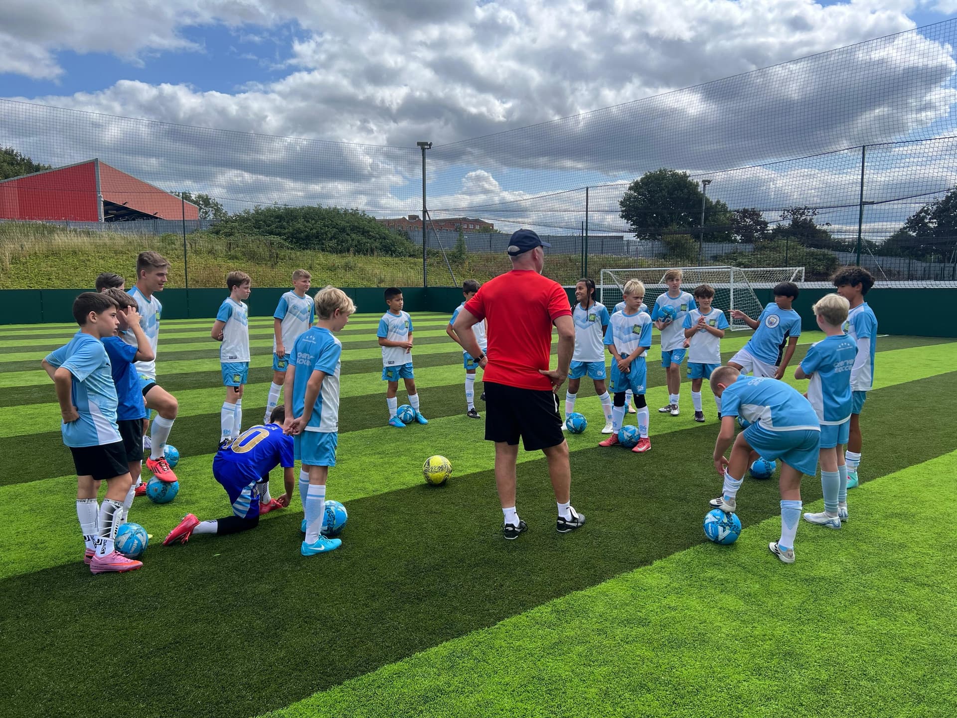 A youth coach observing an English academy training session on an IPPE coaching tour
