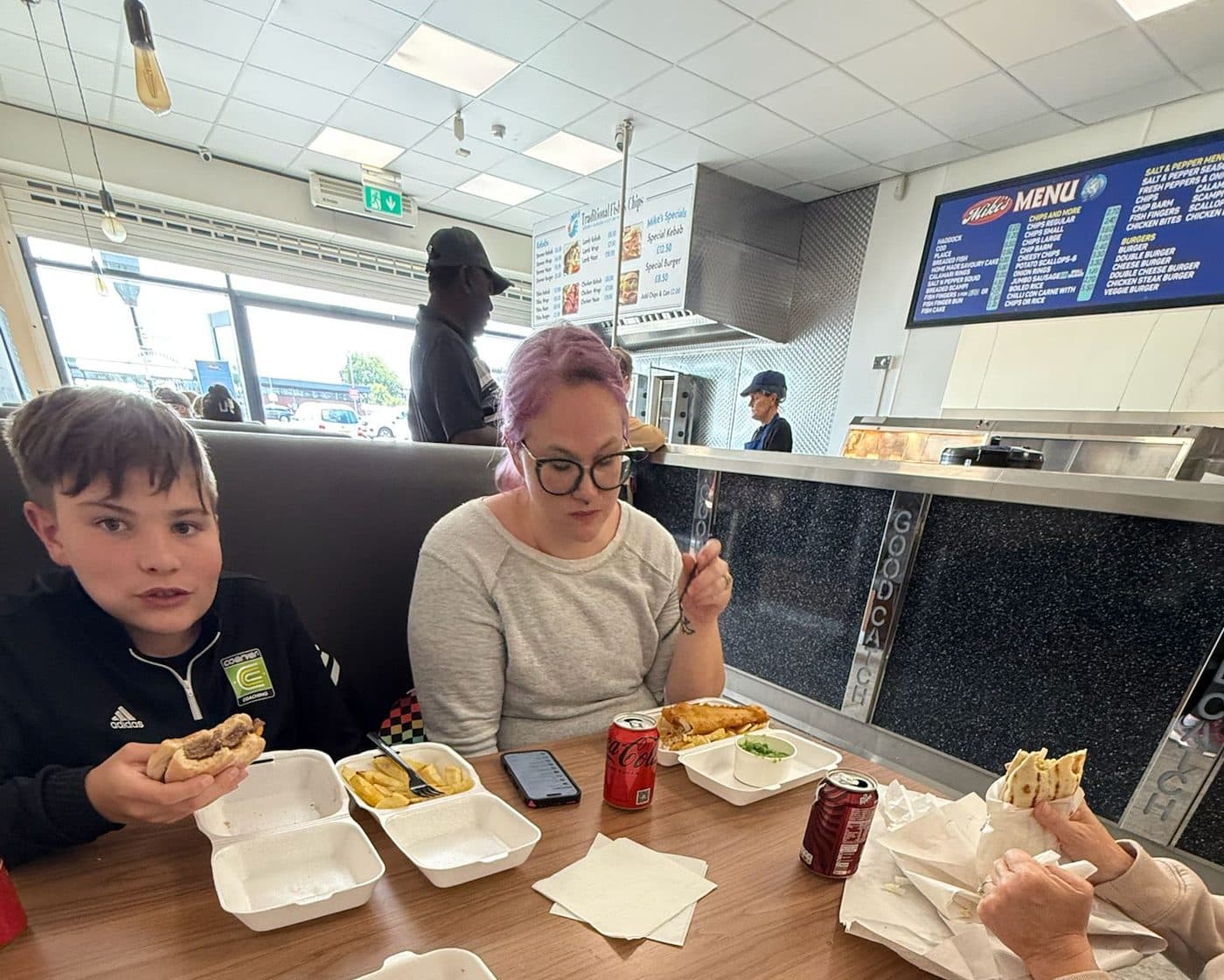 A family sharing a meal together on an IPPE soccer tour in England