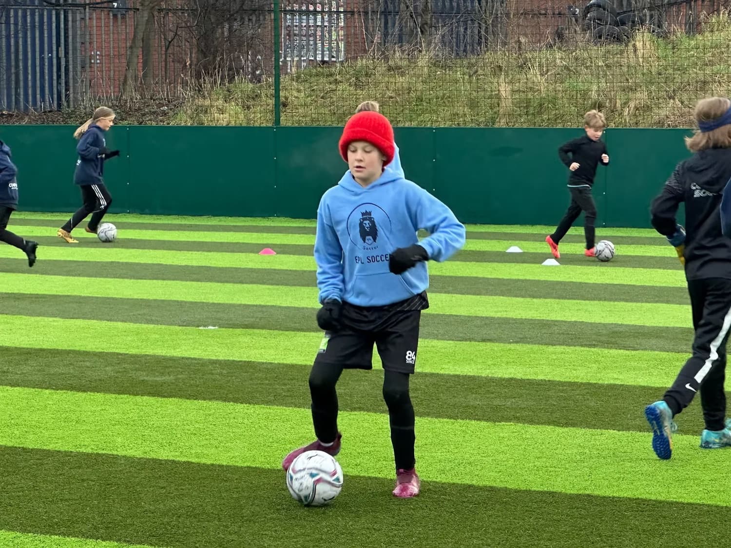 Players on an IPPE soccer tour in the Everton environment
